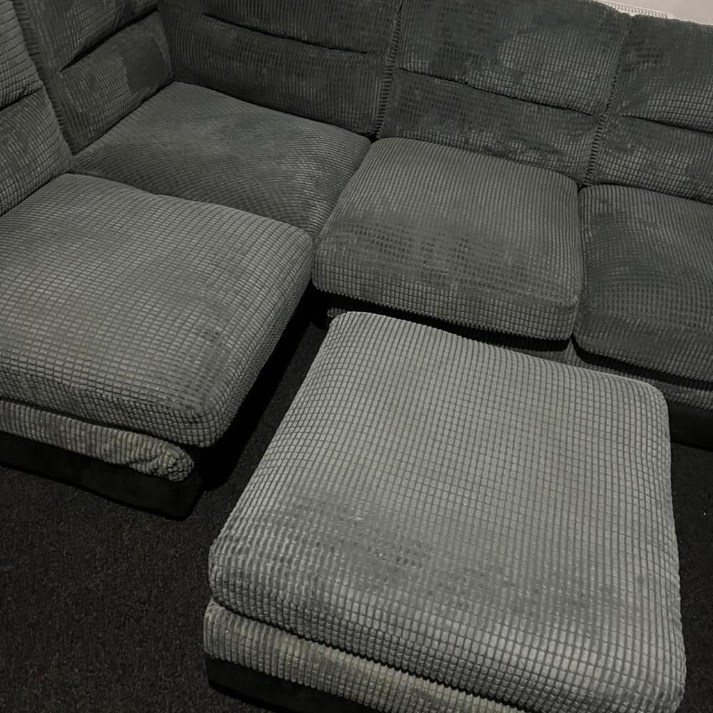 Corner sofa with extra seat/foot rest.