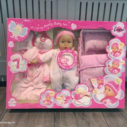 Brand new, unopened.
Large 18" interactive baby doll set.
7 functions as shown in photos such as baby cries, talks, giggles, snores etc.

Lots of accessories included including baby nightgown and large carry cot.

Great gift for any young child.

For aged 3+.

Requires batteries.

Box is very large - 20" height X 27" length.

Happy to answer any questions.