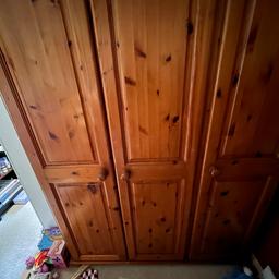 Triple antique pine wardrobe. Shelves up at top plus hanging space. Mirror in single section of the wardrobe. Slight crack on the lip of the double door however this does not impact on the wardrobe’s functionality. Buyer to take down on collection but we are able to help if needed. From smoke free home.