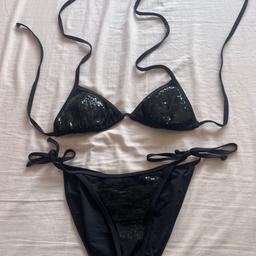 Black sequinned bikini with triangle top and tie side bottoms, by Next. Top is size 10 and bottoms size 8. Worn a few times but still in very good condition.