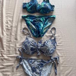 Bundle of 2 bikinis in shades of blue, with adjustable straps on the bikini tops, by Next and F&F. 
Both bikini bottoms are size 8 and the tops are a size 10/CD & 32 FG but this fits more like a 32 CD. I am selling together as a bundle as they both fit the same, size 8/10.
Both worn a few times but washed and still in good condition.
Happy to sell separately for £2 each or as a bundle for £3.50.