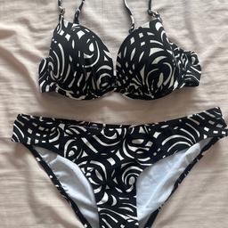 Black and white patterned bikini with adjustable straps, by Debenhams. 
Bottoms are a size 10 and top is a size 34C.
Hardly worn so still in very good condition.