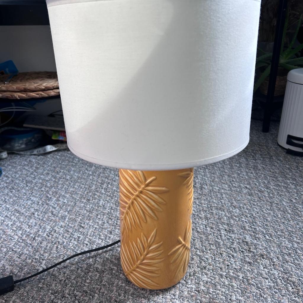 Used. Mustard colour. The lampshade is bigger than original so slightly moves.