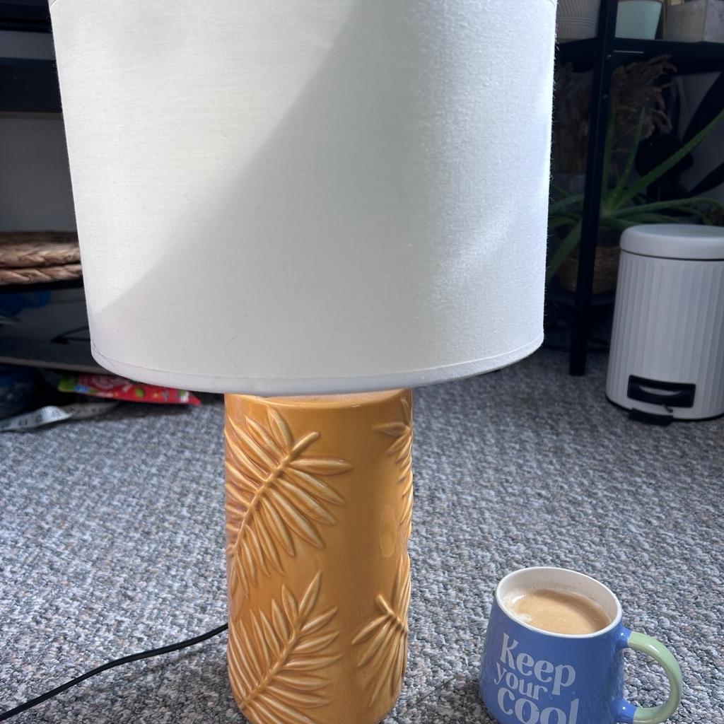Used. Mustard colour. The lampshade is bigger than original so slightly moves.
