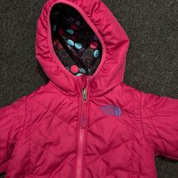 This fashionable and unique jacket from The North Face is a perfect addition to your little girl's wardrobe. Made of high-quality nylon and lined with 100% polyester, this quilted jacket is designed to keep your child comfortable and warm. It comes in a print and beautiful pink colour to n the reverse and is suitable for girls aged 2 years old. reversible feature, allowing you to change up your child's look without having to buy a new jacket. It's perfect for any occasion, whether it's a family day out or a trip to the park. This item is a must-have for any fashion-conscious parent looking for a practical and stylish jacket for their little girl.