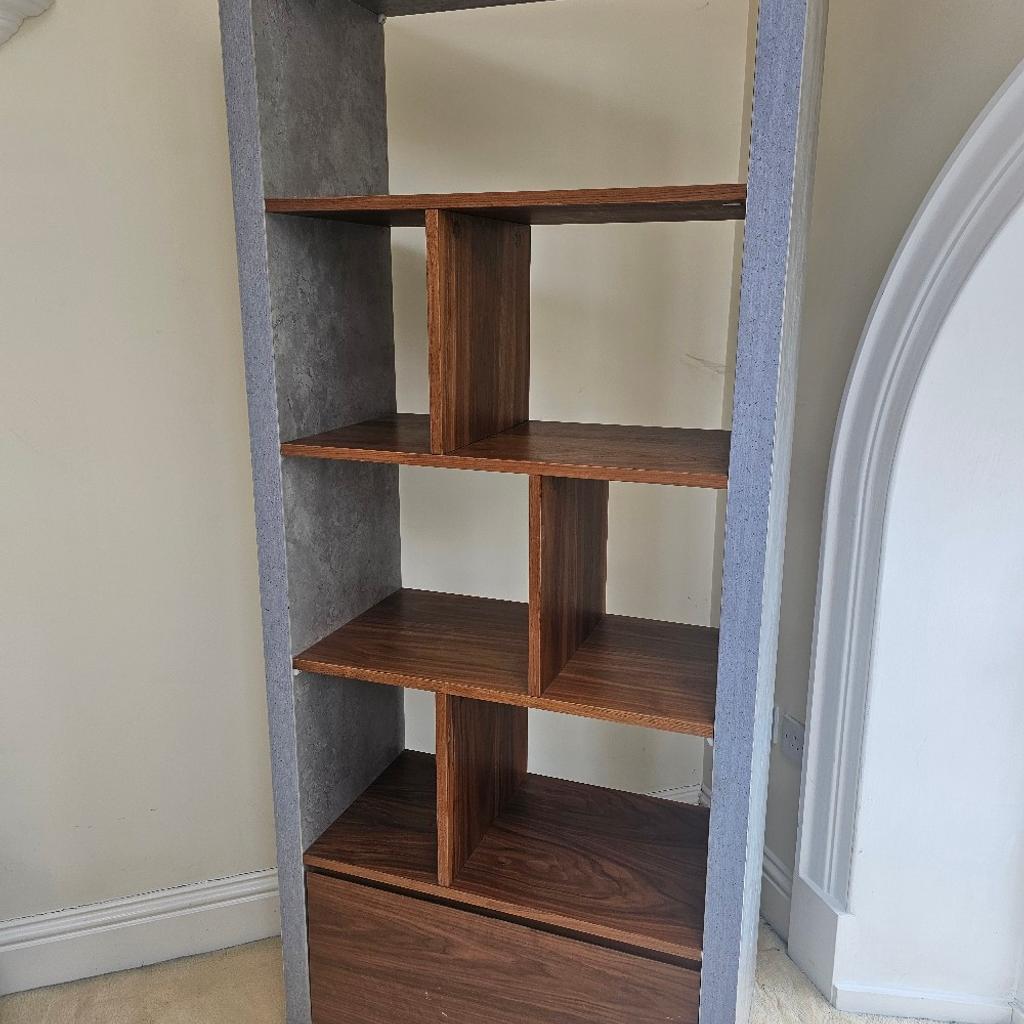 Grey stone and wood display unit.
Very good quality.
Shelves with bottom drawer.
Scrathes on drawer as shown in image.
L 74inch X 31.5inch
Open for offers to come as a set with TV Stand and/or Dining table