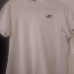perfect condition white Nike shirt comes with black Nike shorts