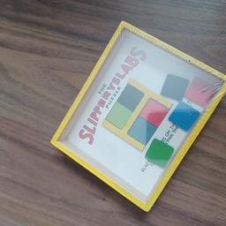 slipperyslabs wooden puzzle brand new still got plastic cover.Slip the tiles into the right place to match colours sounds easier than it is £2.50 collect only.