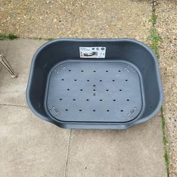 lovely plastic dog bed with folderble feet.
dog won't go in it