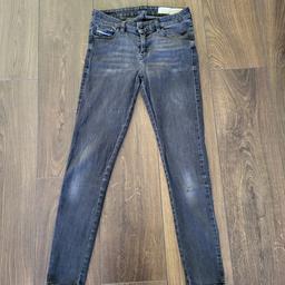 Black skinny jeans from Diesel in size W28. Preloved and quite distress look