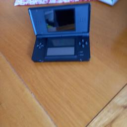 Vintage Nintendo ds lite console with charger and extras. Also includes 17 games(see photos) and carry cases.  Bargain.