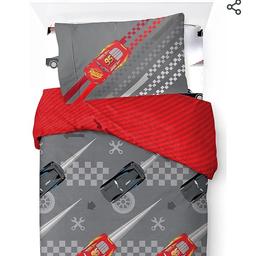 brand new in packaging lightning McQueen full single bedding set and matching curtains.