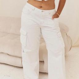 Beautiful white cargo jeans, they’re snug around the bum so they make your bum look good, then they have a baggy fit around the legs so they’re very comfortable. I wore them in the rain one time and after washing there are minimal mud splatters around the bottom of the legs but they’re not that noticeable.