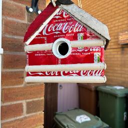 Handmade Coca Cola bird house made from reclaimed timber & Coca Cola tins then hand painted has a opening door on bottom so bird house can be cleaned out has had a coat of clear varnish to help protect the timber