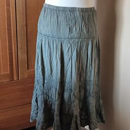 Lovely flared maxi skirt in khaki green with sequin detail at the lower part of the skirt in good pre-owned condition Brand Kushi.
Selling other items please check them out.
Collection only B33