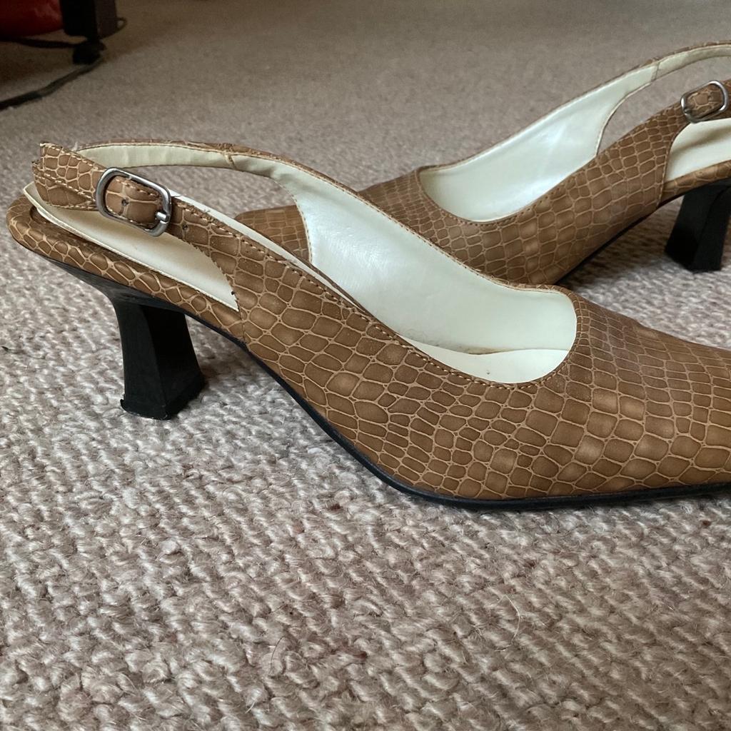 Have been worn several times, still look in good condition apart from left heel is missing the sole, see photos. Heel height is 2.5in