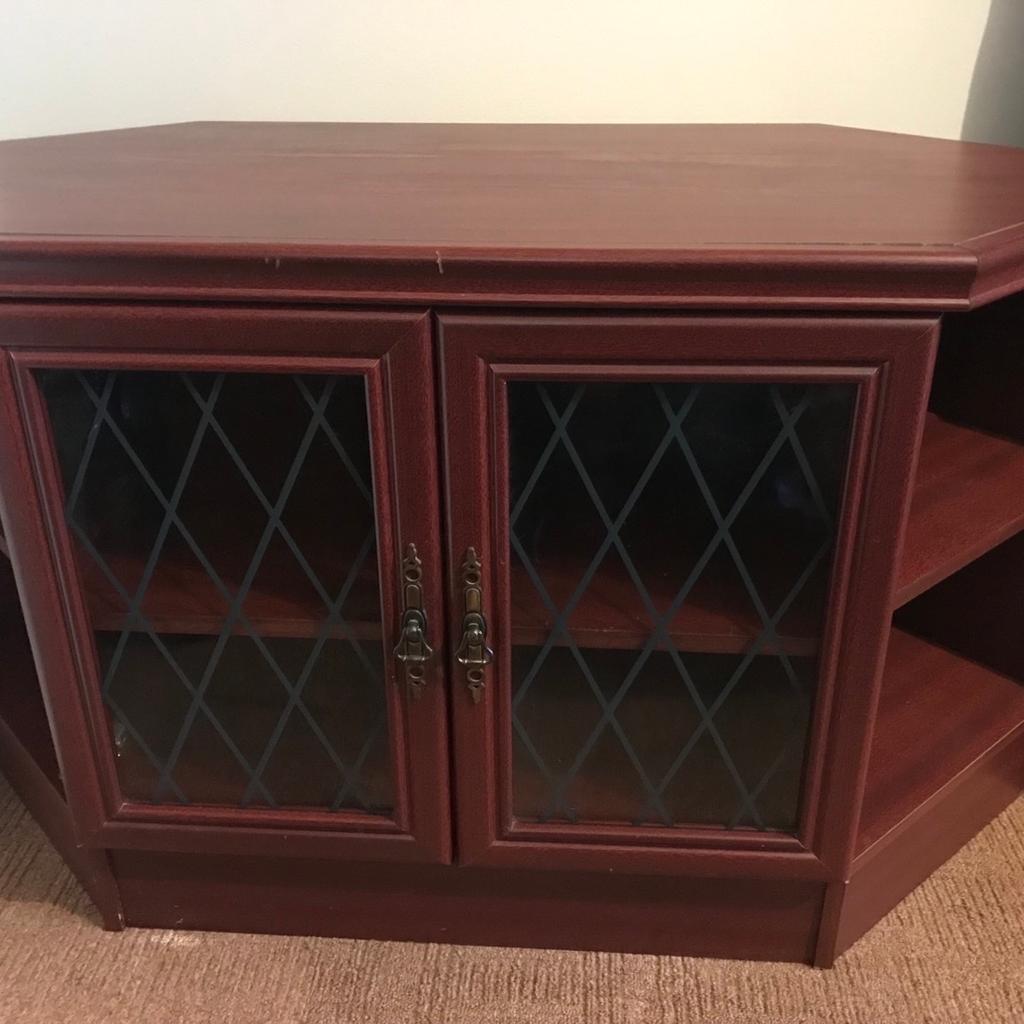 TV corner unit good condition there is a scratch just above the doors as you can see on the pictures