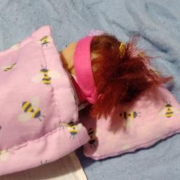 Suitable for small baby dolls between 6 and 12 inches. Handmade by myself from recycled materials. Used, but in very good condition. Includes duvet, pillow and white flat sheet. Doll not included.