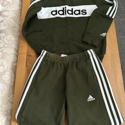 Adidas tracksuit jumper and joggers.bottoms worn more than top. Slight mark on top as can see in picture and bottoms faded around waistband.smoke and pet free home.