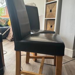 4 solid oak, black leather chairs, fair condition leather is peeling off in some area’s & some scratches. These chairs are so comfortable & perfect for an up-cycle or covering.