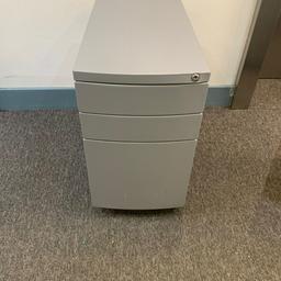 office silver slim filing cabinet pedetal under desk 

good working order some scratches nothing major 

56cm depth 31cm width 56cm height 

no key but they can easily be ordered online 

collection South London SW16 Norbury