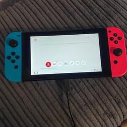 Nintendo switch comes boxed with everything. Also comes with an extra wireless controller.  Few surface scratches on the screen from being out in and out the dock. Doesn’t affect usage at all as they aren’t visible during gameplay. Collect from bilston