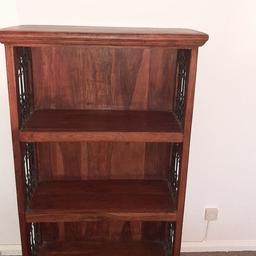 Beautiful heavy bookcase, wrought iron side details.