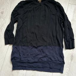 Black with dark blue border ,3/4 sleeves. says large, but I think it will fit medium. I ALSO HAVE size small and XS . They were used as uniforms at Selfridge’s Louis Vuitton shop. 100 % Laine/WOOL 
