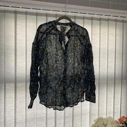 Brand new next blouse
Black blue and gold threads all over 
Prettier than pictures as I can’t capture the colours 
U.K. 12