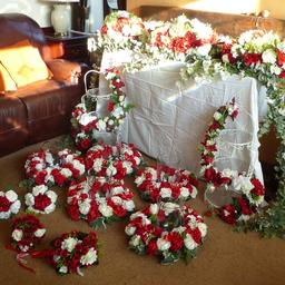Floral displays for Wedding, Christening or any appropriate celebration. 
Red & White with Green Fauna. 
Includes:
Main table display. 
5 table centre pieces. 
2 floral decorated afternoon tea/cake stands. 
4 bouquets. 
Over £1400 of floral material used to make these displays. 
Only used once for a Wedding in 2018.
Space required so no longer able to store.
£300 for a quick sale.