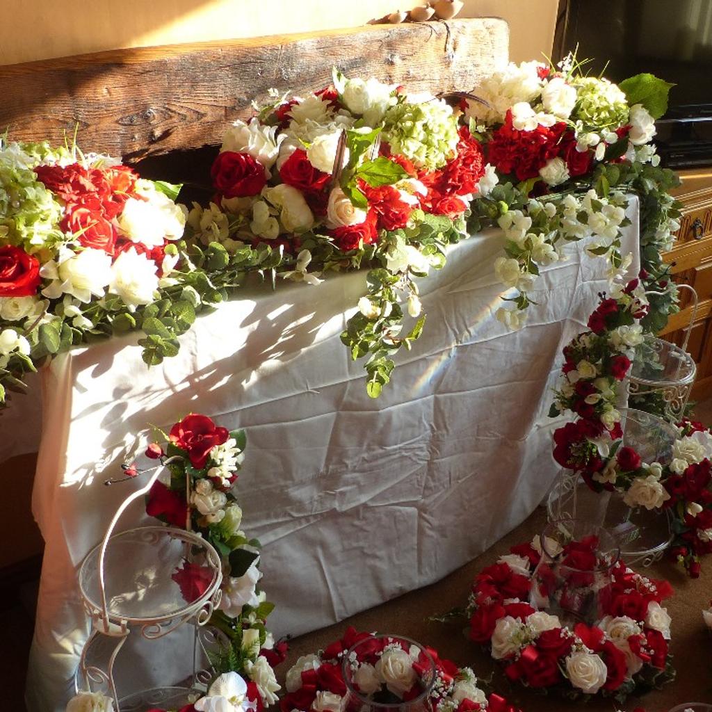 Floral displays for Wedding, Christening or any appropriate celebration.
Red & White with Green Fauna.
Includes:
Main table display.
5 table centre pieces.
2 floral decorated afternoon tea/cake stands.
4 bouquets.
Over £1400 of floral material used to make these displays.
Only used once for a Wedding in 2018.
Space required so no longer able to store.
£300 for a quick sale.