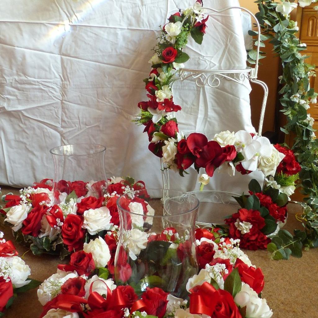 Floral displays for Wedding, Christening or any appropriate celebration.
Red & White with Green Fauna.
Includes:
Main table display.
5 table centre pieces.
2 floral decorated afternoon tea/cake stands.
4 bouquets.
Over £1400 of floral material used to make these displays.
Only used once for a Wedding in 2018.
Space required so no longer able to store.
£300 for a quick sale.