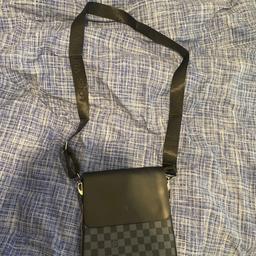 Black and grey lv messenger bag used but still in good condition