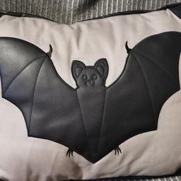 Vintage sourpuss cushion leatherette design with a bat motif on the front
Can be collected from Batley or can post for additional cost via PayPal