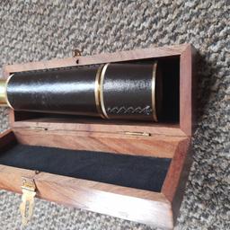 A brass and leather telescope in its original wooden box..PayPal or bank transfer or collection only. postage to be paid