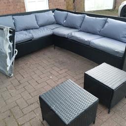 rattan garden set in good condition comes with cushons and brand  new table glass is black