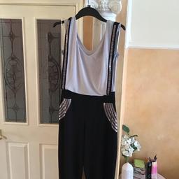 Only wore few times in very good condition 
Colour black and grey with silver trim at the front chest size 36ins inside leg 32ins waist 
Size 30 ins material polyester very stretchy