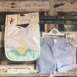 THIS IS FOR A SMALL BUNDLE OF BOYS CLOTHES

1 X WHITE AND BLUE SHORTS - CANDY STRIP WORN ONCE SO  IN EXCELLENT CONDITION
1 X NEW BIB WITH GIRAFFE THEME 

PLEASE SEE PHOTO