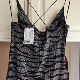 sparkly cowl neck mini dress size 8 stretchy would also fit a 10.
with tags