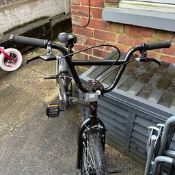 Boys x rated spine black bmx, 20” wheel. Barely used but does have a couple of marks on the end of the handlebars. Comes with an extra set of stunt pegs fitted and a black helmet. Collection from Somercotes