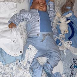 Been looked after reborn boy doll, comes with clothes, blanket, magnetic dummies, shoes, bibs, hat, coat