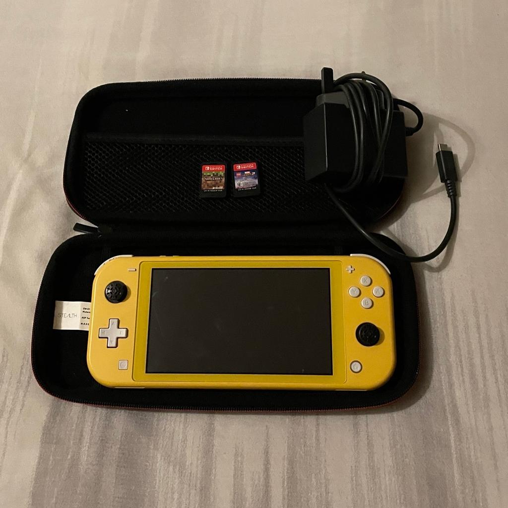 Nintendo Switch Lite With Case , Charger and Two Games .
Only used a few times