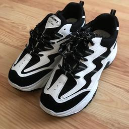 Black and white trainers. Label says size 39(6) but they come up smaller and fit size 5.5.