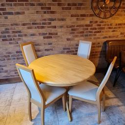 Round dining table and 4 chairs in good condition.

table = 120cm
