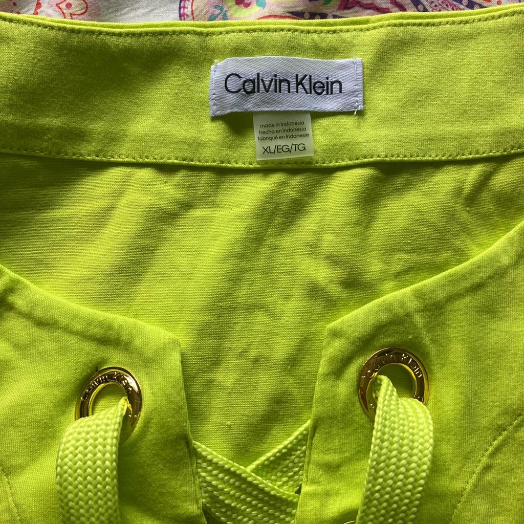Here in selling this neon green Calvin klein dress new with tags size xl I would say 12/14 uk please take a look at my other stuff any questions please ask thankyou x