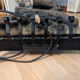 Wrought iron log fire effect fan heater. Fully working. Can be used as an addition into a fireplace or freestanding. Collection in person only please. Will consider good offers.