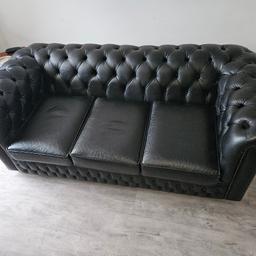 Black leather Chesterfield sofa. its literally like new hardly been used.
made my saxon furniture. 6ft long 3ft wide 2.2ft high cost £1700 will accept o.i.r.o £700