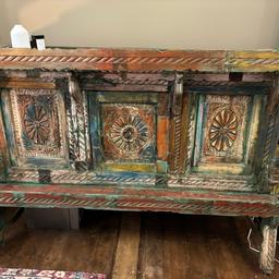Vintage Indian/gujrati Damchiya/Sideboard, over 200 years old in excellent sturdy condition. Had a door in the middle which opens into storage inside, plenty of space to store items if you wish. 

Absolutely gorgeous and a statement piece for any home - this no longer fits my space so unwillingly having to get rid.

Perfect for a kitchen, dining, living or hallway space, a definite conversation starter! 

Price is negotiable.

Dimensions:
Width 158cm
Height 120cm
Depth 50cm

Collection and cash upon collection please! 
Based in East London, Newham.