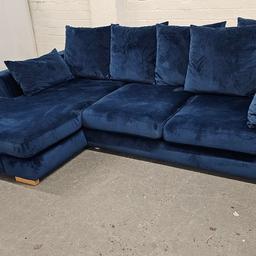 A left hand facing DFS sofa part of the Plush range in a velvet blue in immaculate condition No rips tears or stains.

This is a dfs sofa not a cheaply made replica or copy.

Delivery is available short notice please message for more details 

Measurements 
Width 300cm
Depth 100cm
Chaise depth 163cm
Height 86cm

Viewings are welcome just message me for more details 

If you have any other queries please do let me know