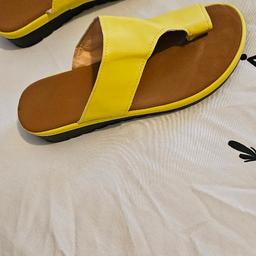 brand new sandals yellow never worn good for your feet really comfortable but to big for me thanks for looking